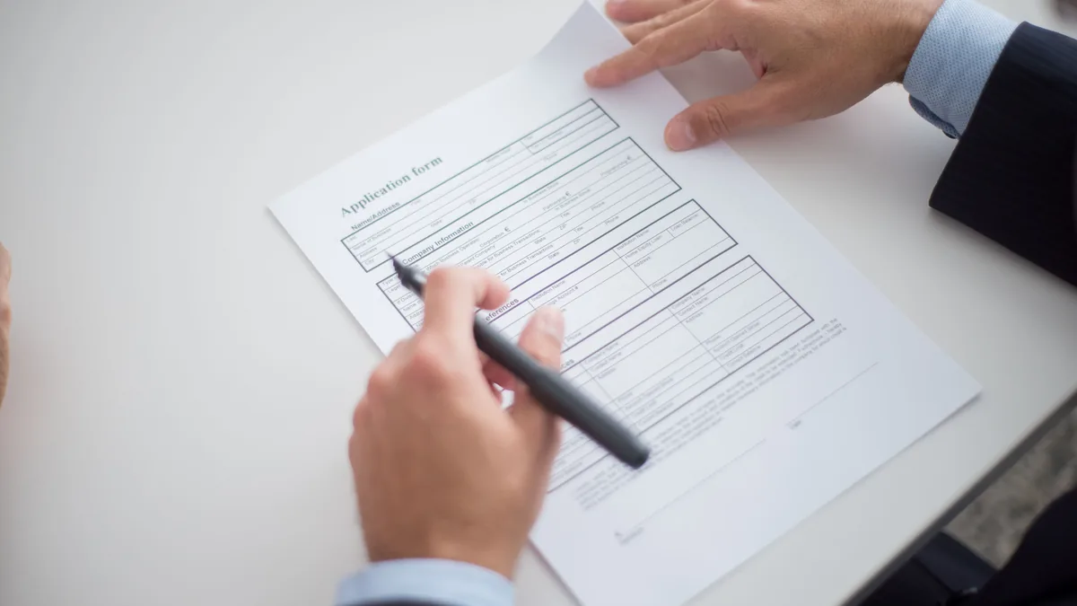Reviewing a formal application, similar to the process a fiduciary company follows for MIMIT authorisation